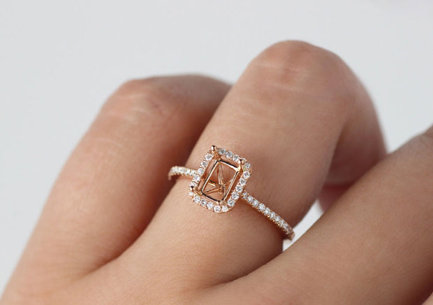 Solitaire emerald cut diamond ring